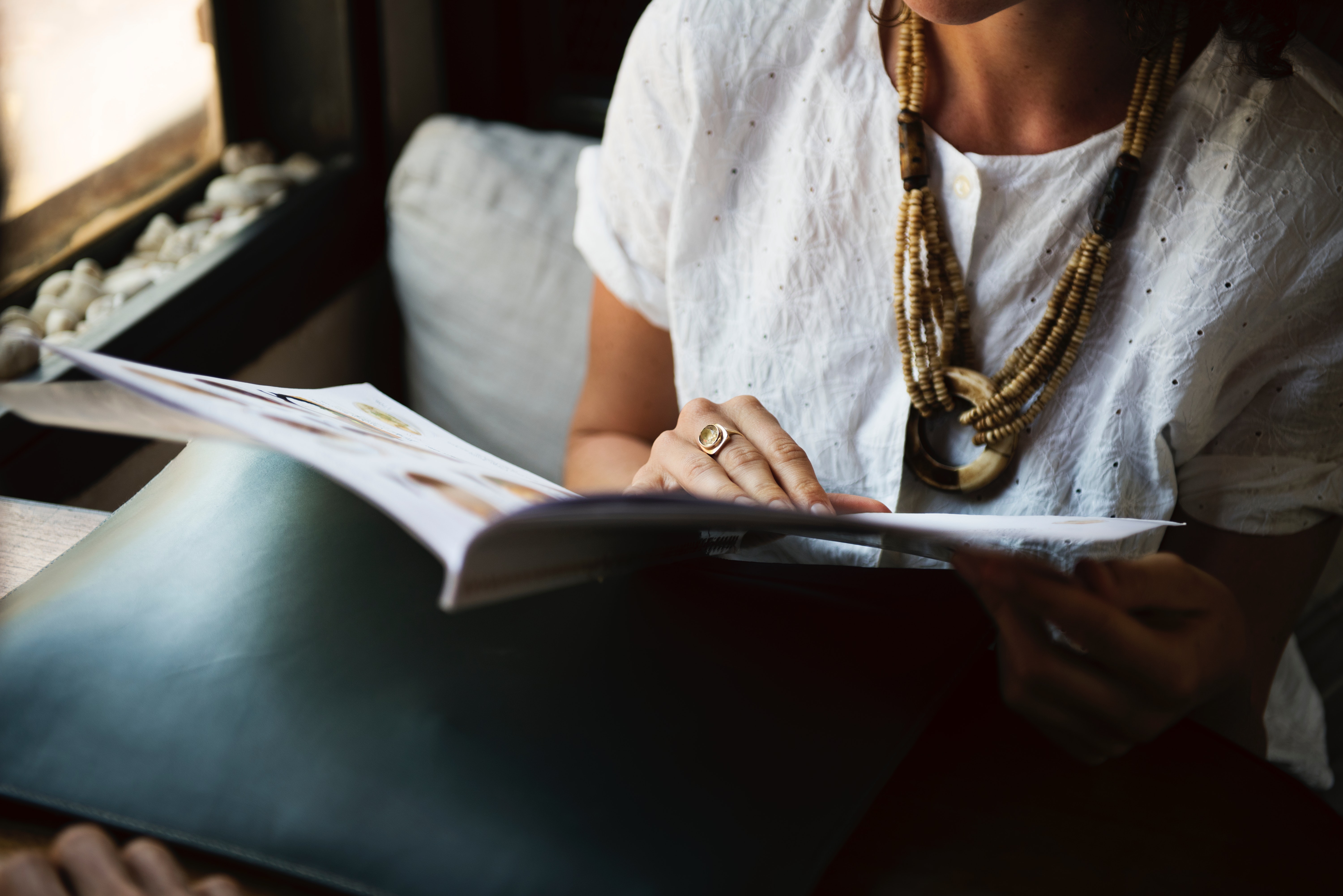 woman reading a newsletter